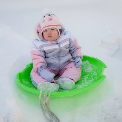 Child in snow saucer.